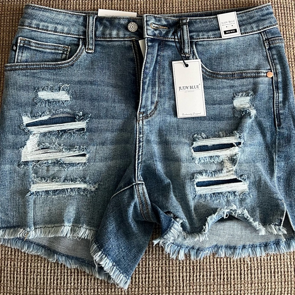 Women’s Judy Blue Denim Shorts, size Large. New with tags, distressed look.